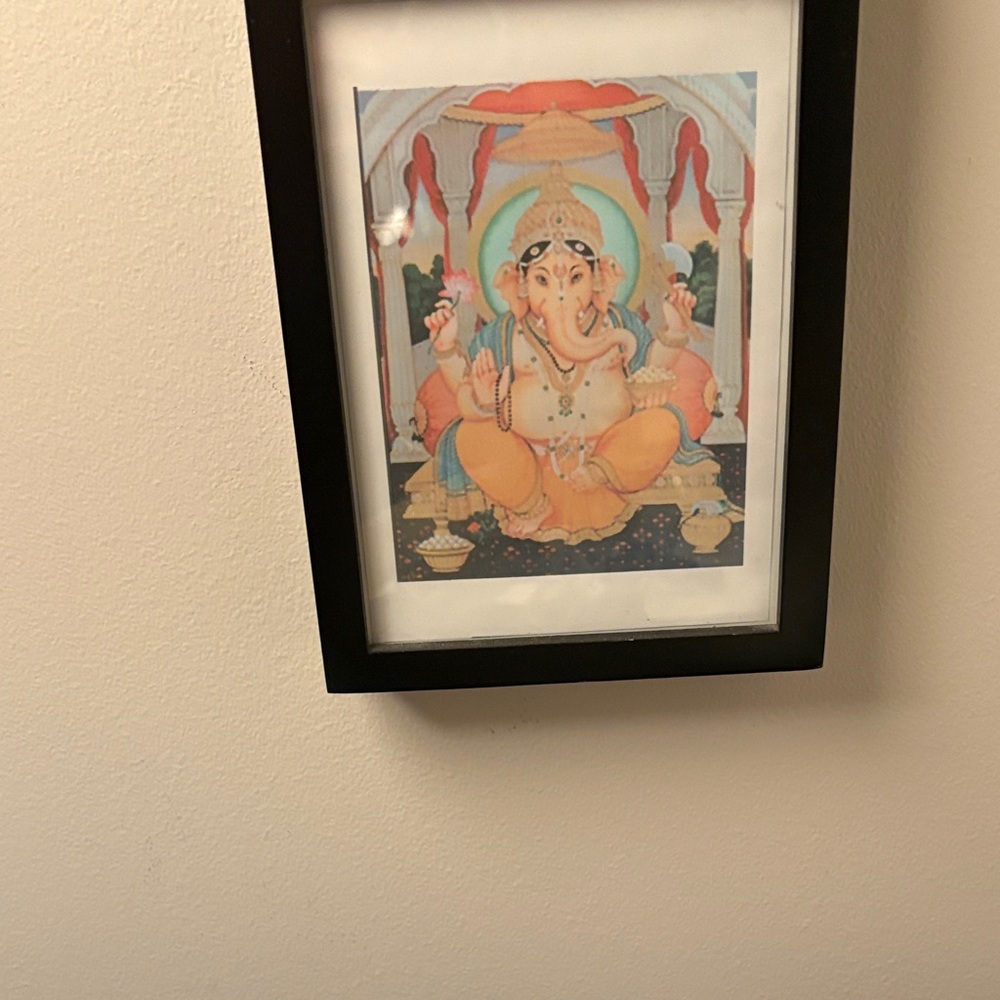 Ganesha Artwork Lovingly in Black Picture Frame with 90s vibes.